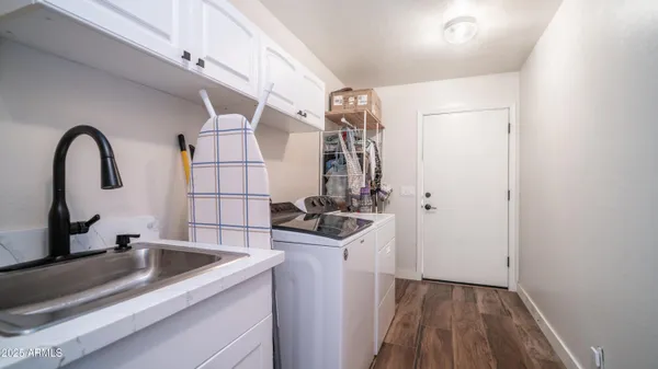 a kitchen with a sink and a refrigerator