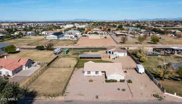 an aerial view of residential houses with outdoor space