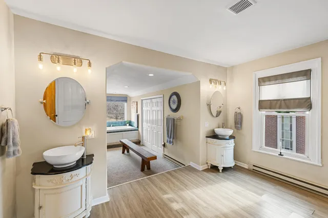 a living room with furniture a window and a fireplace