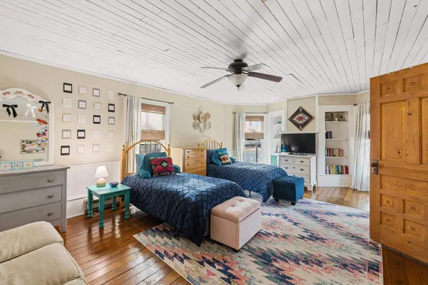 a living room with furniture a fireplace and a window