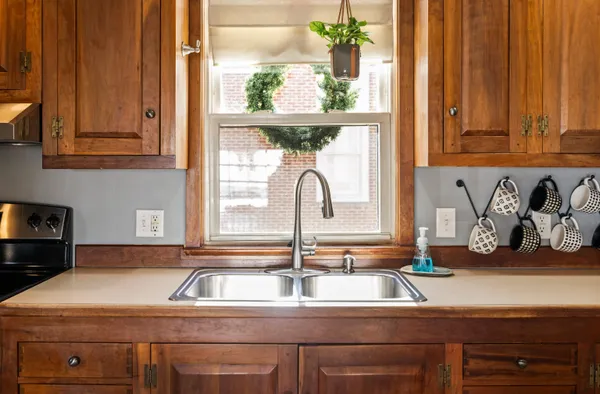 a kitchen with a sink and a window