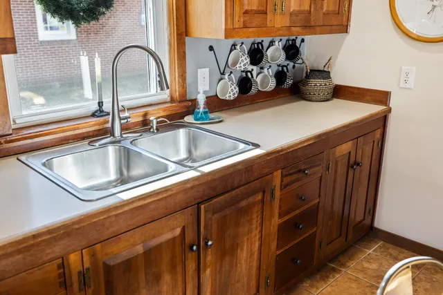 a kitchen with a sink and a stove