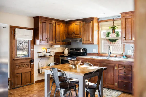 a dining room with furniture and window