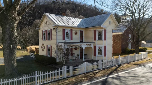 a front view of a house with parking space
