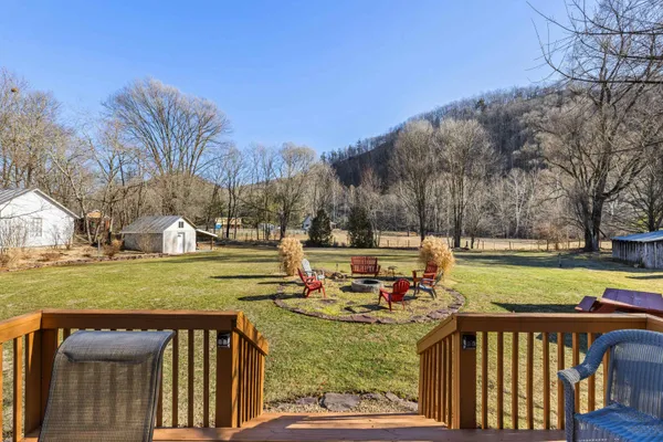a view of a yard with swimming pool