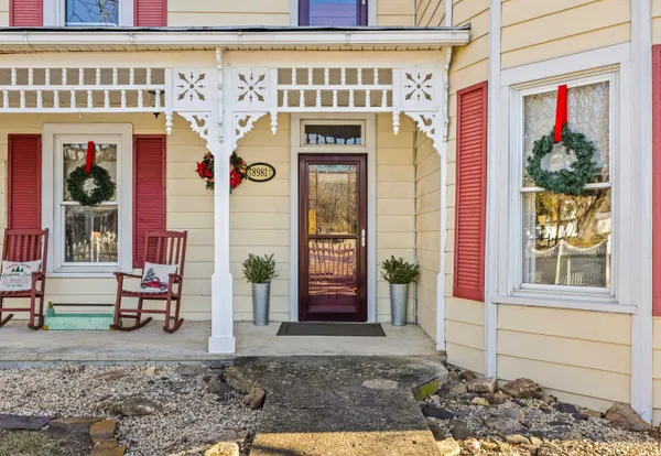 a front view of a house with large windows