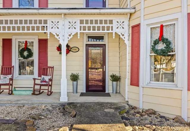 a front view of a house with large windows