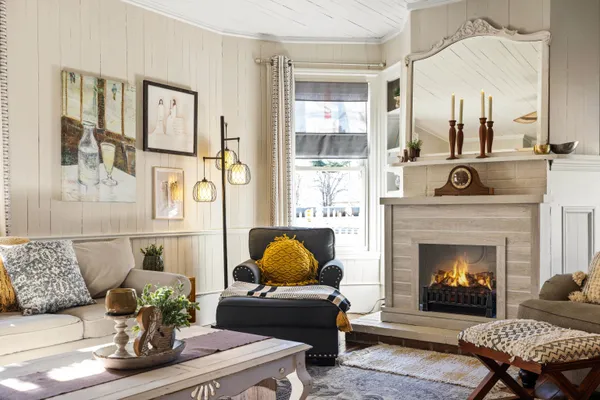 a living room with furniture and a fireplace