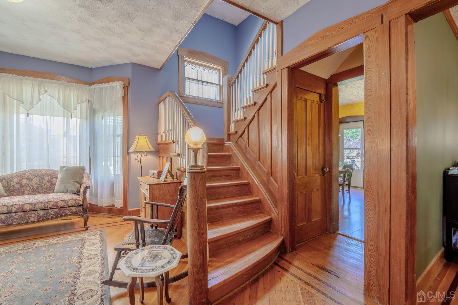 314 Walnut Street Dunellen, NJ 08812 - Photo 11 of 48 a view of a livingroom with furniture and staircase