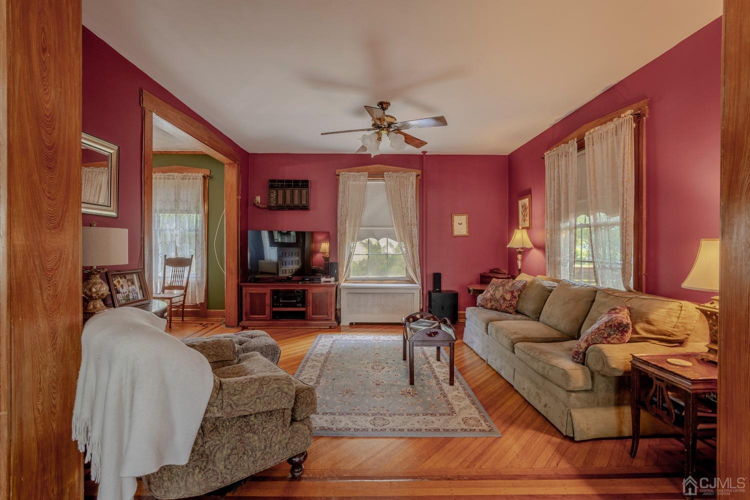 314 Walnut Street Dunellen, NJ 08812 - Photo 12 of 48 a living room with furniture ceiling fan and a window