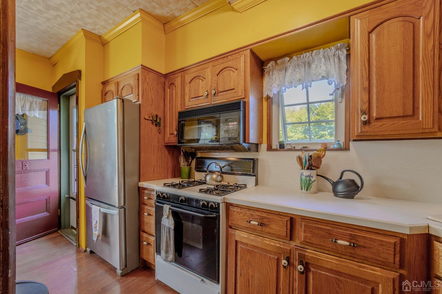 314 Walnut Street Dunellen, NJ 08812 - Photo 19 of 48 a kitchen with stainless steel appliances granite countertop a granite counter tops and a refrigerator