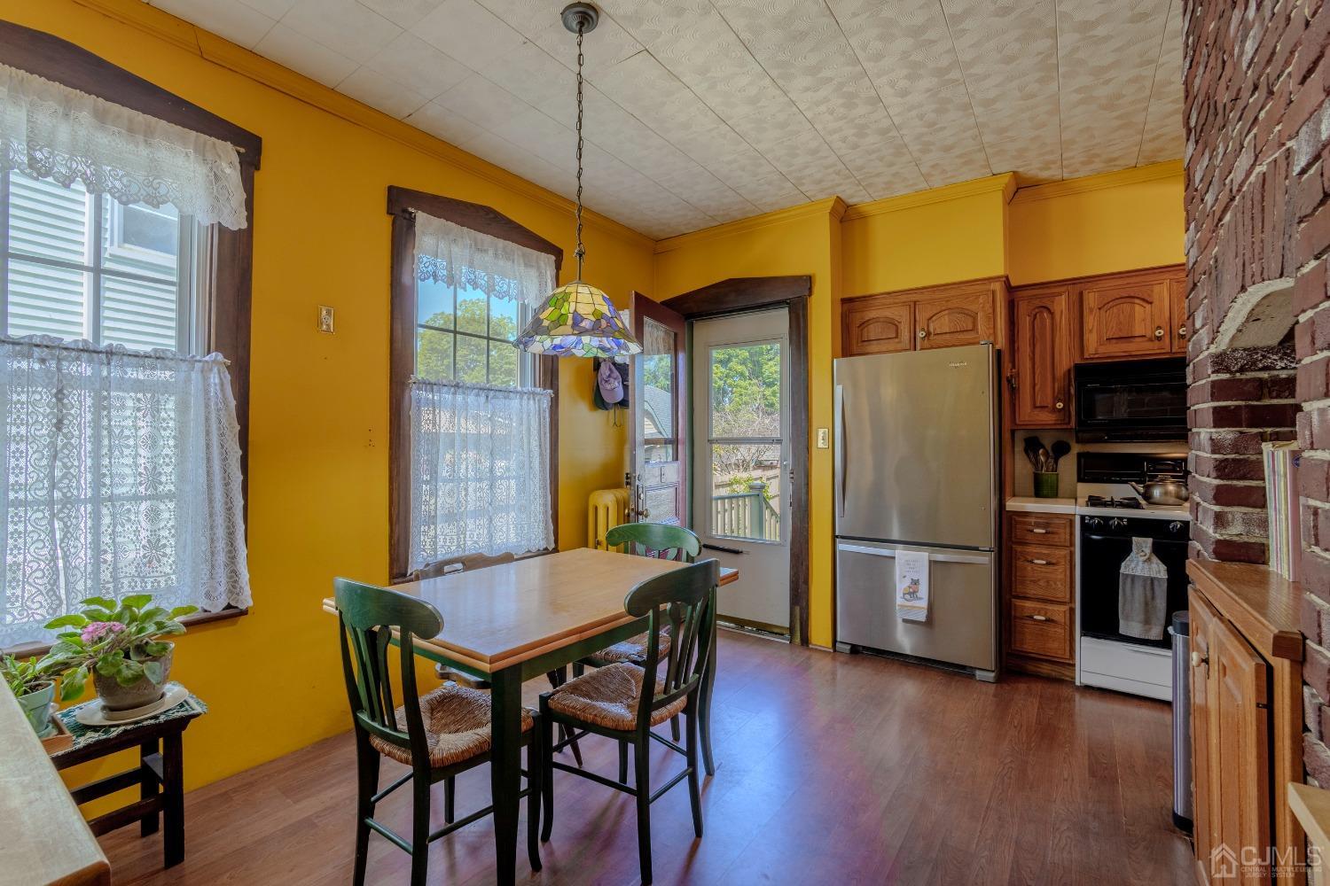 314 Walnut Street Dunellen, NJ 08812 - Photo 22 of 48 a view of a dining room with furniture and wooden floor