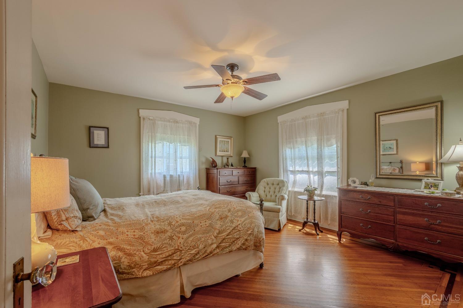 314 Walnut Street Dunellen, NJ 08812 - Photo 25 of 48 a bedroom with a bed and wooden floor