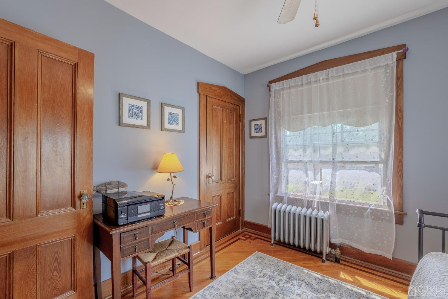 314 Walnut Street Dunellen, NJ 08812 - Photo 29 of 48 a view of a bedroom with furniture and a window