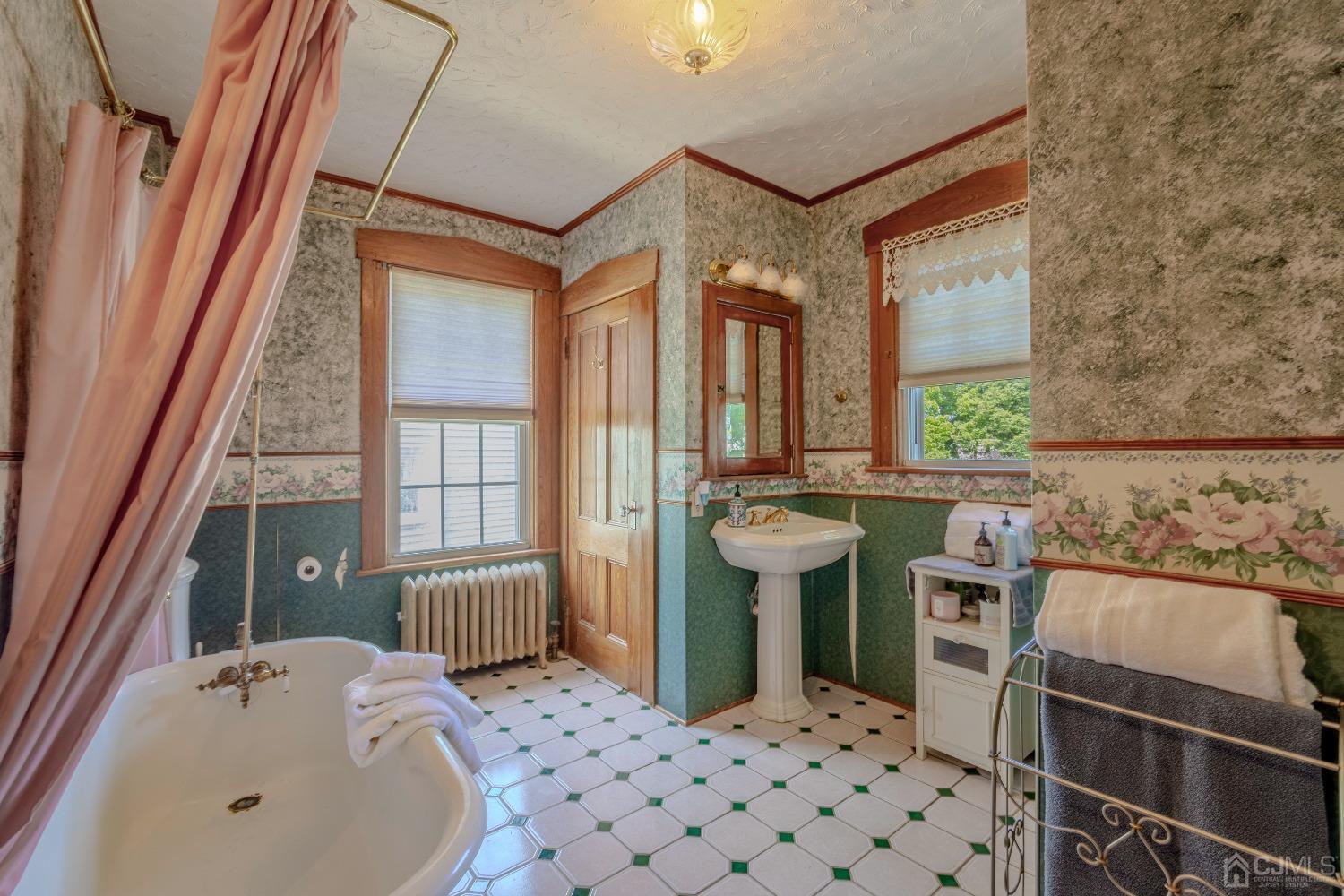 314 Walnut Street Dunellen, NJ 08812 - Photo 30 of 48 a bathroom with a sink and a bathtub