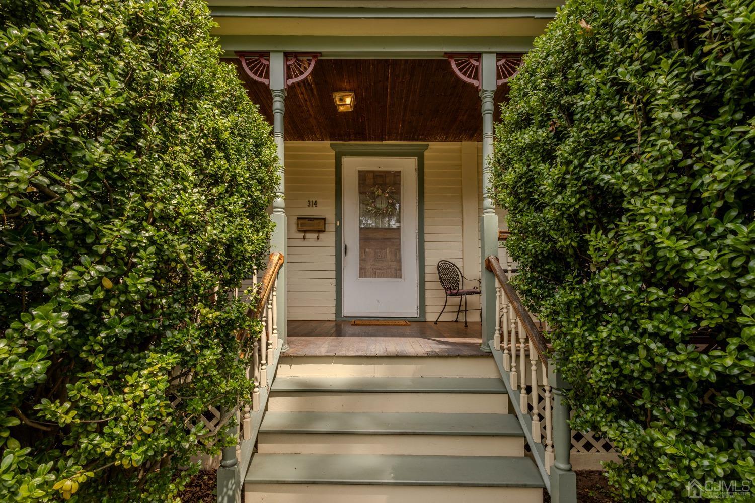 314 Walnut Street Dunellen, NJ 08812 - Photo 3 of 48 a front view of a house with potted plants