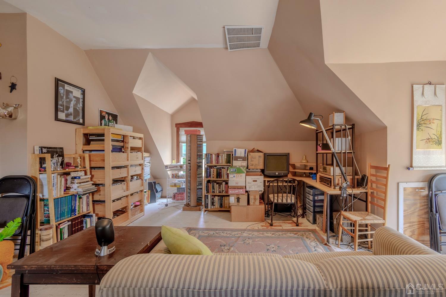 314 Walnut Street Dunellen, NJ 08812 - Photo 33 of 48 a living room with lots of furniture and a chandelier