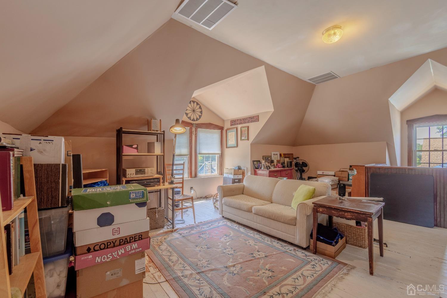 314 Walnut Street Dunellen, NJ 08812 - Photo 35 of 48 a living room with furniture and a flat screen tv