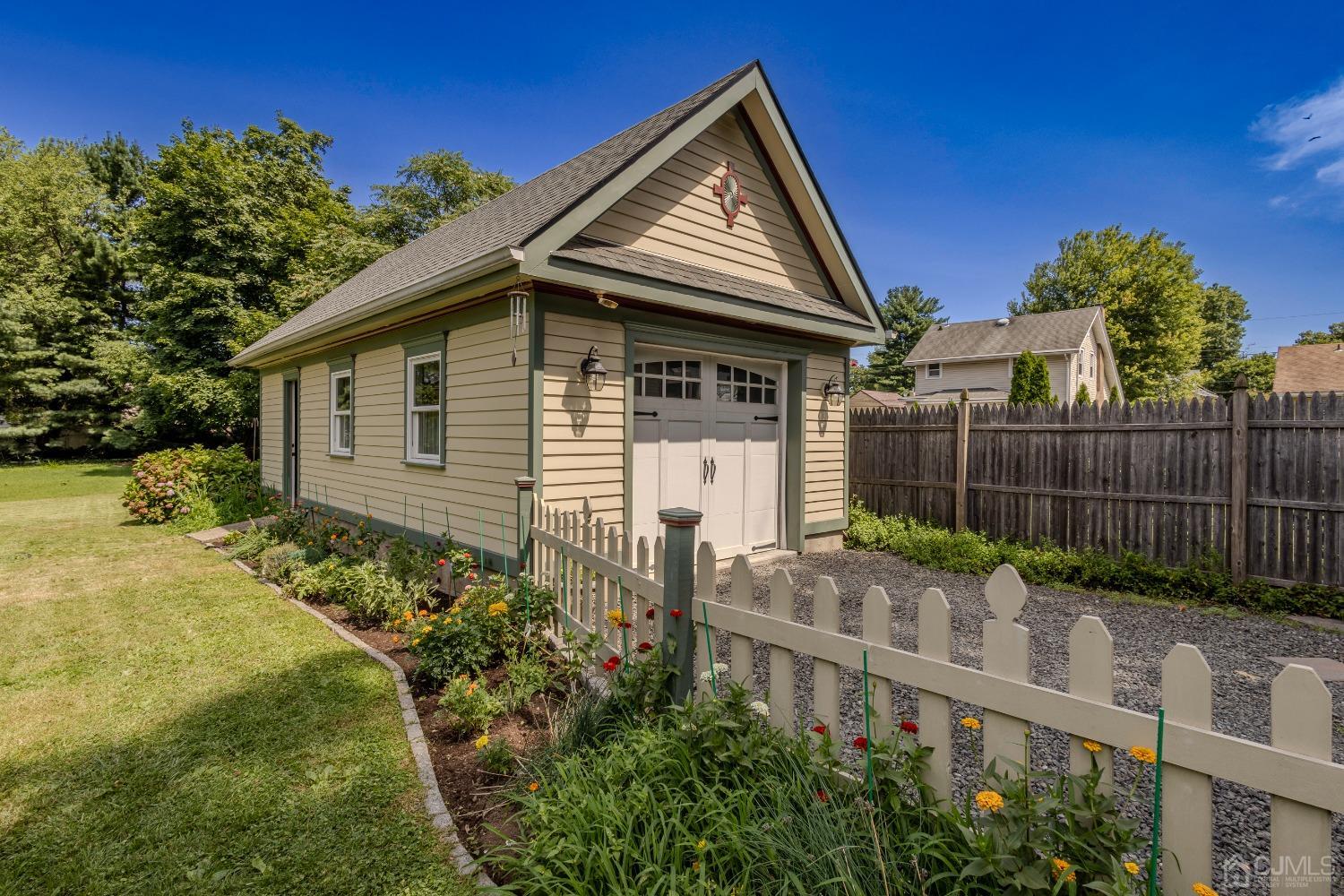 314 Walnut Street Dunellen, NJ 08812 - Photo 39 of 48 a front view of a house with garden