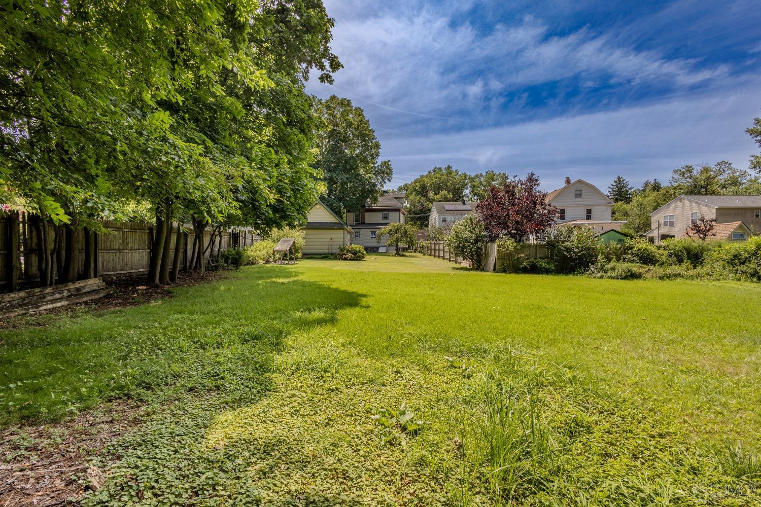 314 Walnut Street Dunellen, NJ 08812 - Photo 44 of 48 a view of a garden with a building in the background