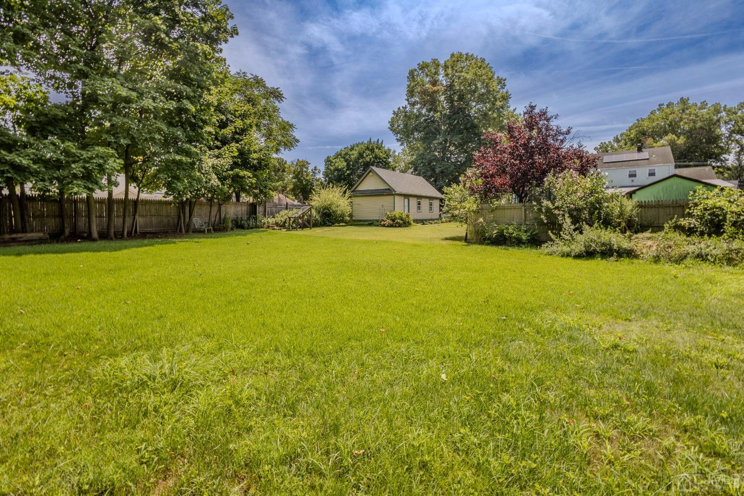 314 Walnut Street Dunellen, NJ 08812 - Photo 45 of 48 a view of a large garden with plants and large trees