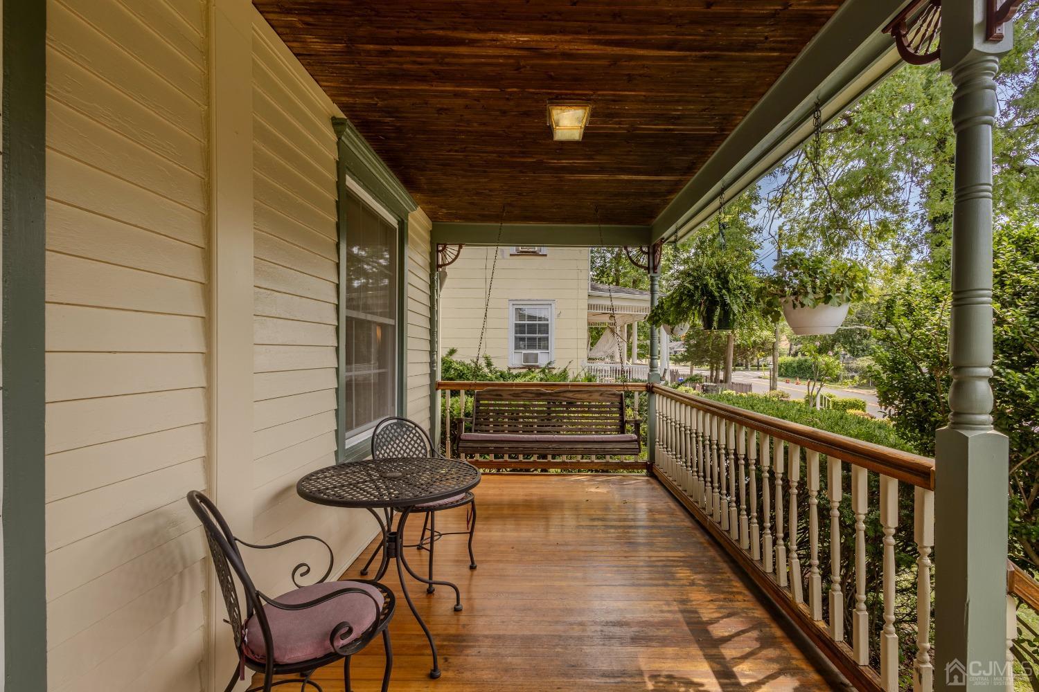 314 Walnut Street Dunellen, NJ 08812 - Photo 5 of 48 a view of a chairs and table in the balcony