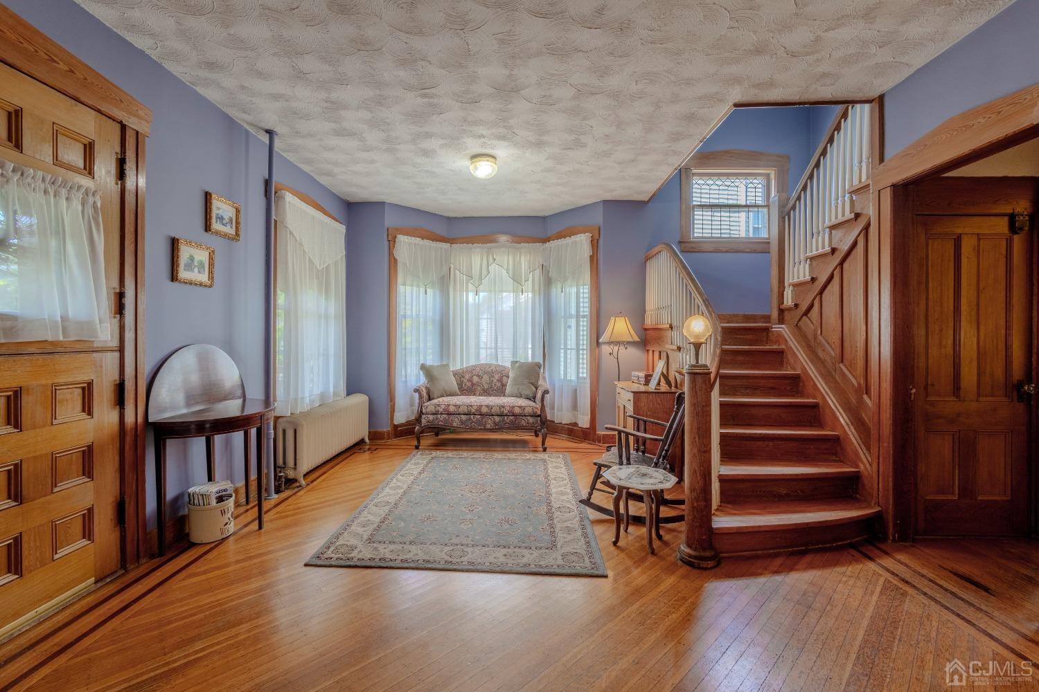 314 Walnut Street Dunellen, NJ 08812 - Photo 6 of 48 a view of a livingroom with furniture and hardwood floor