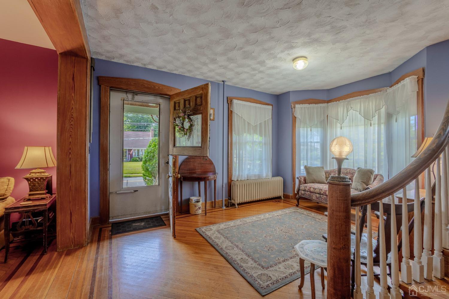 314 Walnut Street Dunellen, NJ 08812 - Photo 8 of 48 a view of a livingroom with furniture and hardwood floor