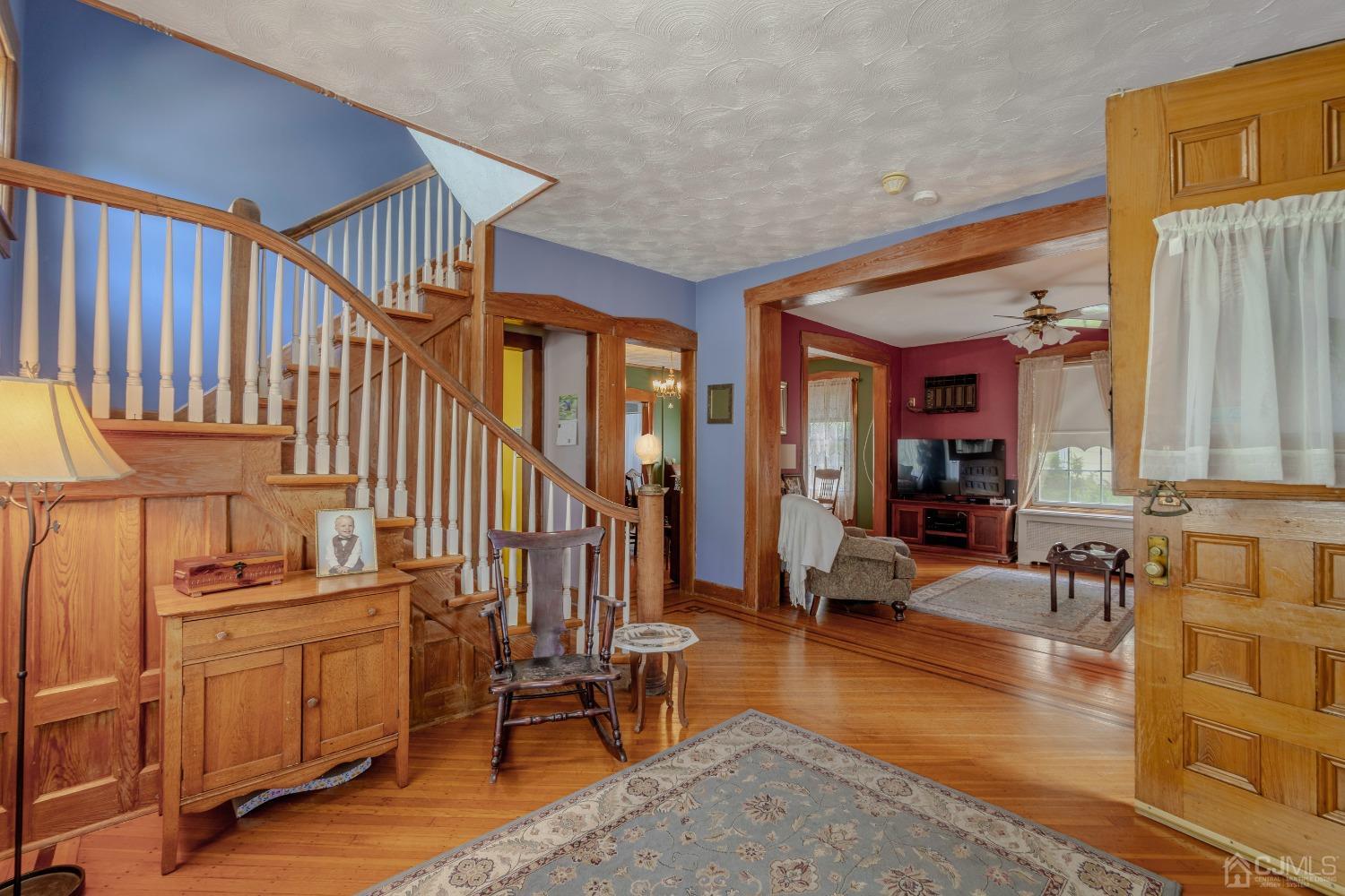 314 Walnut Street Dunellen, NJ 08812 - Photo 9 of 48 a living room with furniture stove and wooden floor