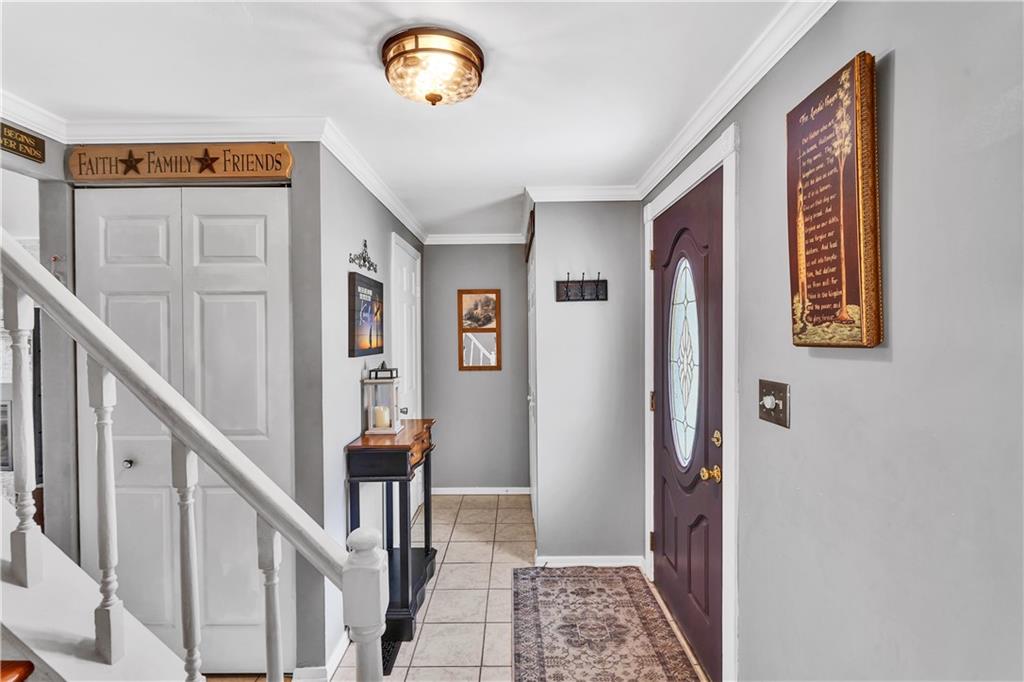 9 Quail Court Export, PA 15632 - Photo 11 of 35 Must Have Coat/Storage Closet at the Entry. Private Guest Half Bath Tucked at Left at End of the Entry Hallway.