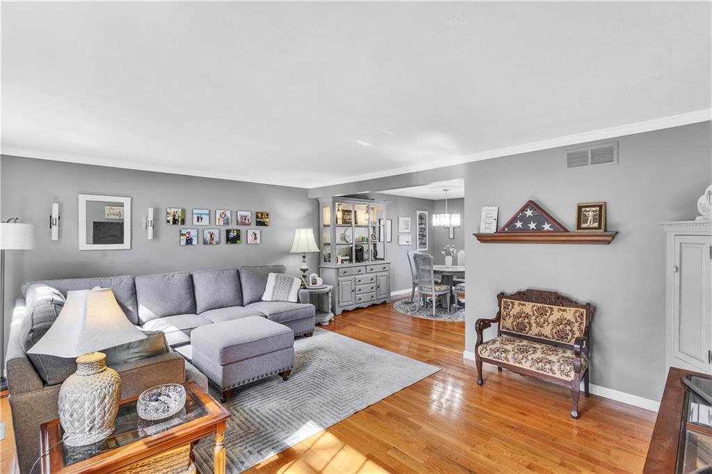 9 Quail Court Export, PA 15632 - Photo 13 of 35 Open Living / Dining / Kitchen Floor Plan with Beautiful Bruce Wood Floors Throughout.