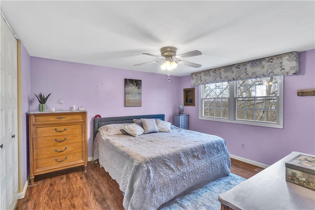 9 Quail Court Export, PA 15632 - Photo 24 of 35 14x14 Primary Bedroom with Ceiling Fan, Wood-Loo, LVP Flooring, and en Suite Private Bath.