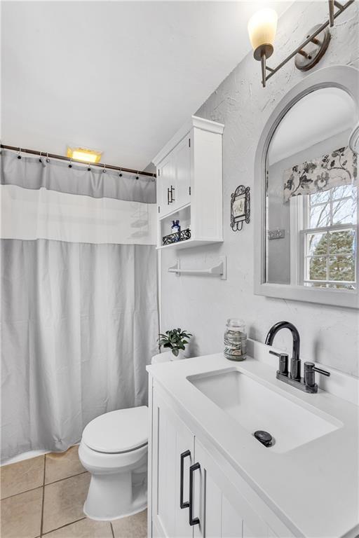 9 Quail Court Export, PA 15632 - Photo 26 of 35 Updated Vanity, Rear Facing Window, and Tile Floor in the Primary Bathroom.