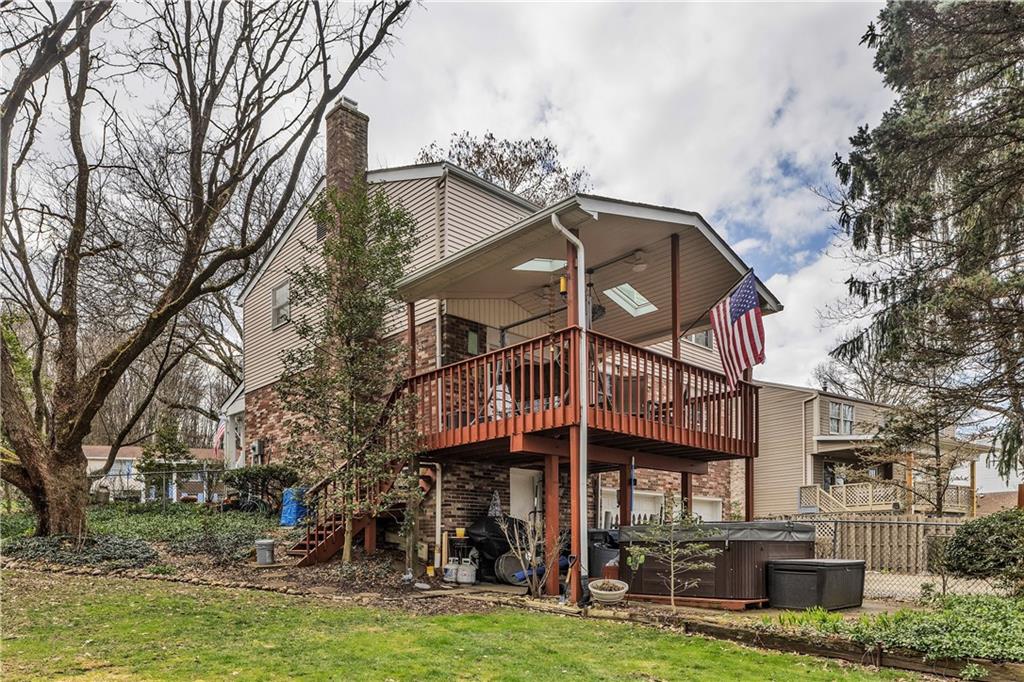 9 Quail Court Export, PA 15632 - Photo 8 of 35 Steps from the Rear Covered Deck Lead to Level, Fence Yard. Walkout Basement Opens to Rear Patio. Hot Tub Does Not Stay, so You will have a Large Patio Area.