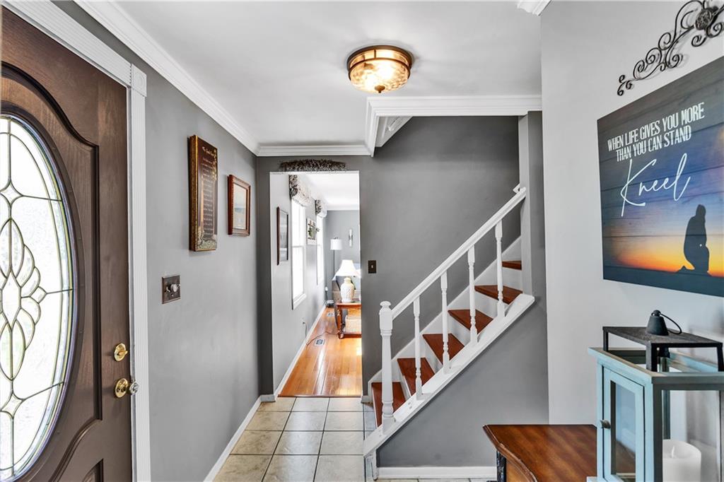 9 Quail Court Export, PA 15632 - Photo 10 of 35 Welcoming 14x5, Tiled Entry with Beautiful Front Door and Crown Molding.