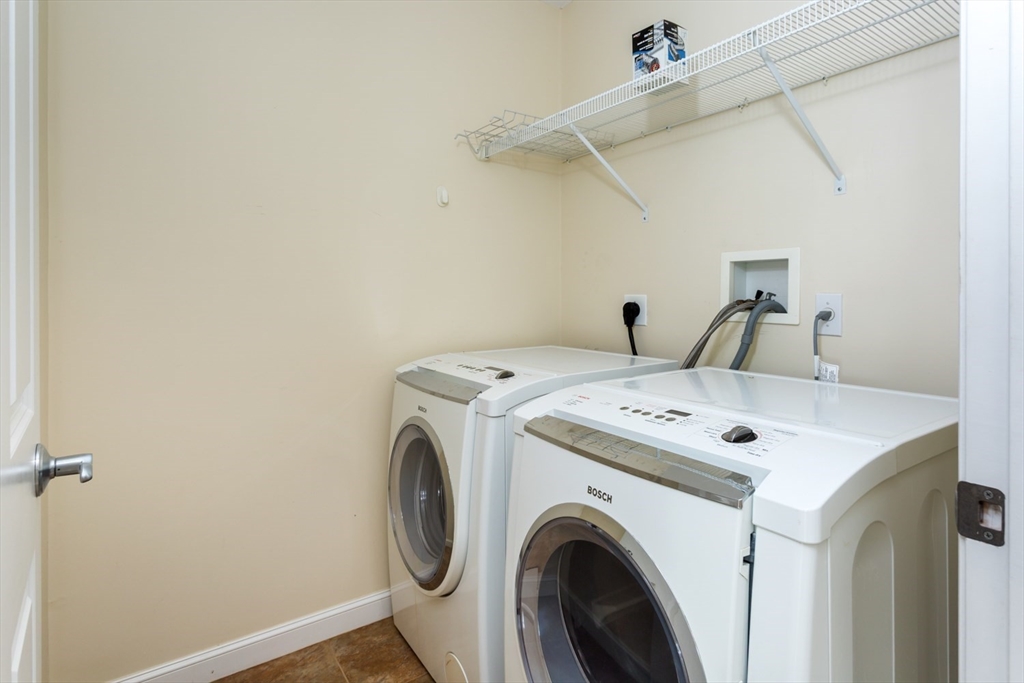 49 Beaver Street, Unit 49 Franklin, MA 02038 - Photo 24 of 46 a utility room with dryer and washer