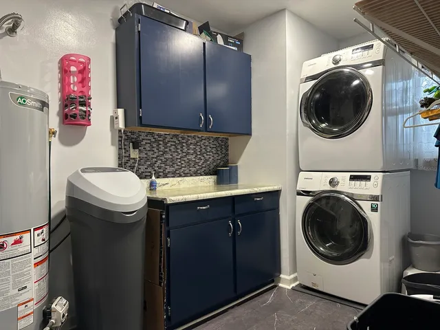 a utility room with sink dryer and washer