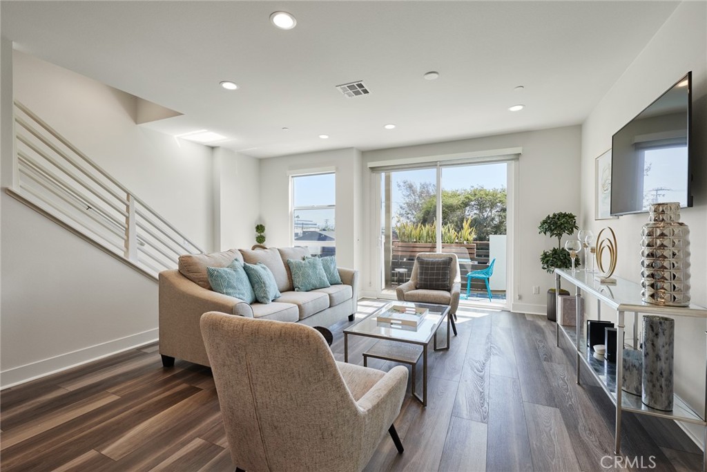 1648 Topanga Costa Mesa, CA 92627 - Photo 13 of 33 a living room with furniture and wooden floor