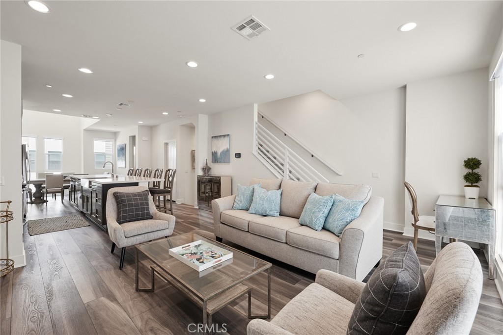1648 Topanga Costa Mesa, CA 92627 - Photo 14 of 33 a living room with furniture and wooden floor