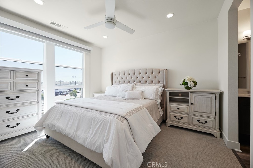 1648 Topanga Costa Mesa, CA 92627 - Photo 17 of 33 a bedroom with a bed and a dresser