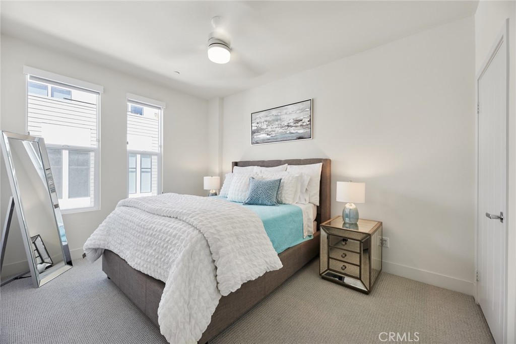 1648 Topanga Costa Mesa, CA 92627 - Photo 20 of 33 a spacious bedroom with a bed and a window