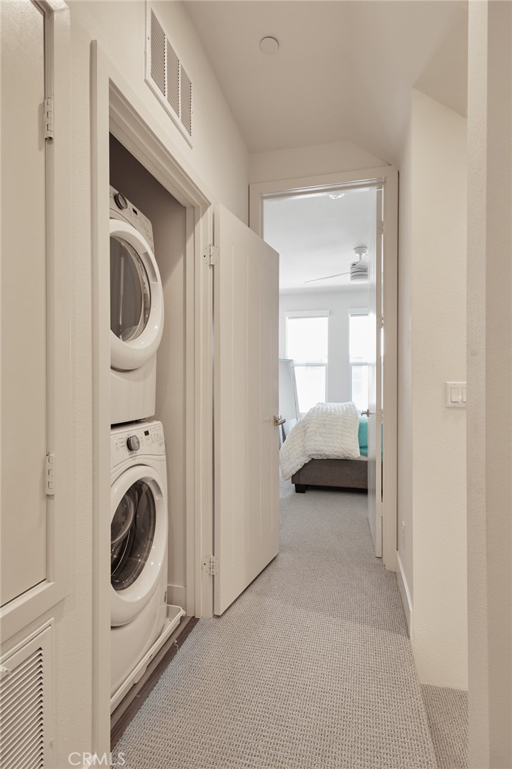 1648 Topanga Costa Mesa, CA 92627 - Photo 22 of 33 a view of a bedroom with washer and dryer