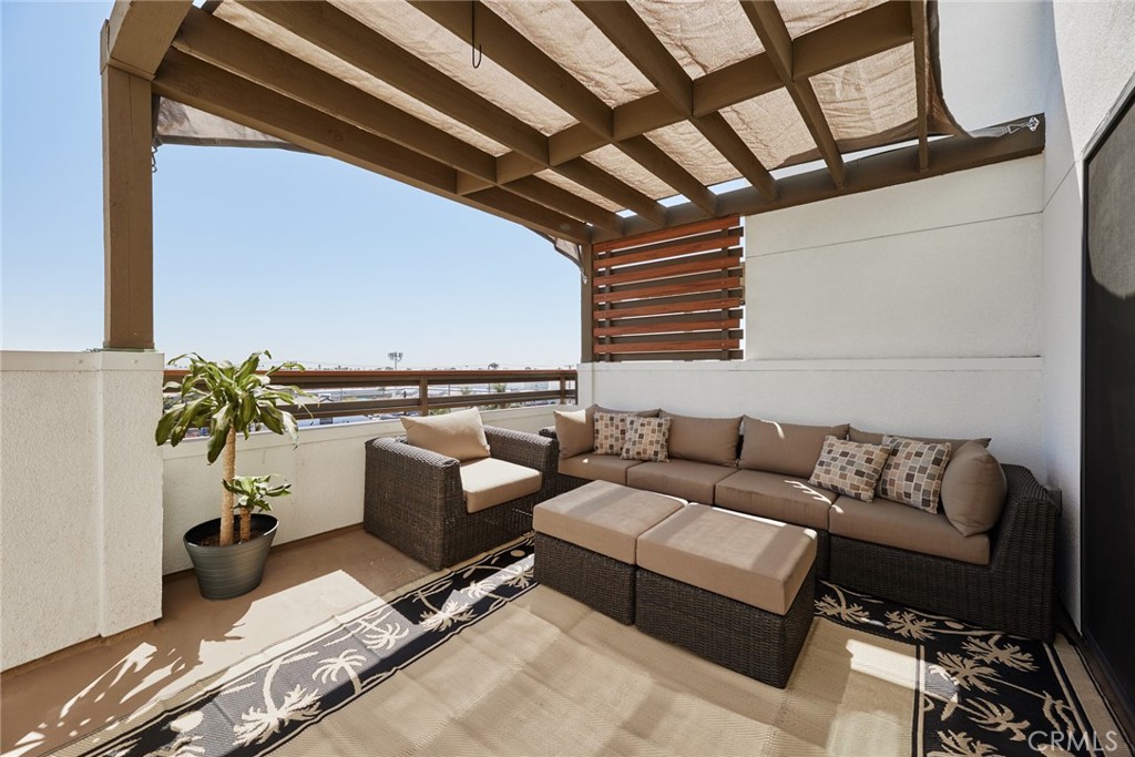 1648 Topanga Costa Mesa, CA 92627 - Photo 26 of 33 a living room with furniture and a potted plant