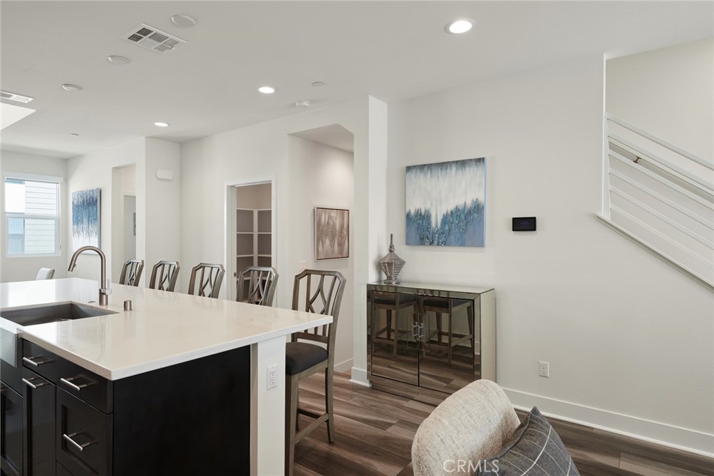 1648 Topanga Costa Mesa, CA 92627 - Photo 8 of 33 a dining room with furniture and wooden floor
