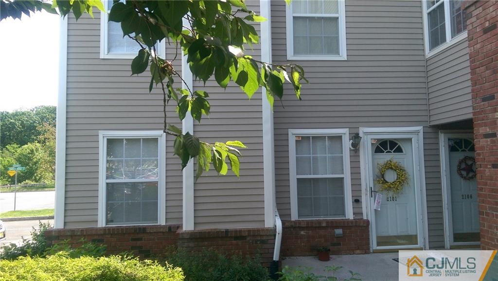 2101 Ridgeview Court, Unit 1 Sayreville, NJ 08859 - Photo 3 of 11 a front view of a house with a yard