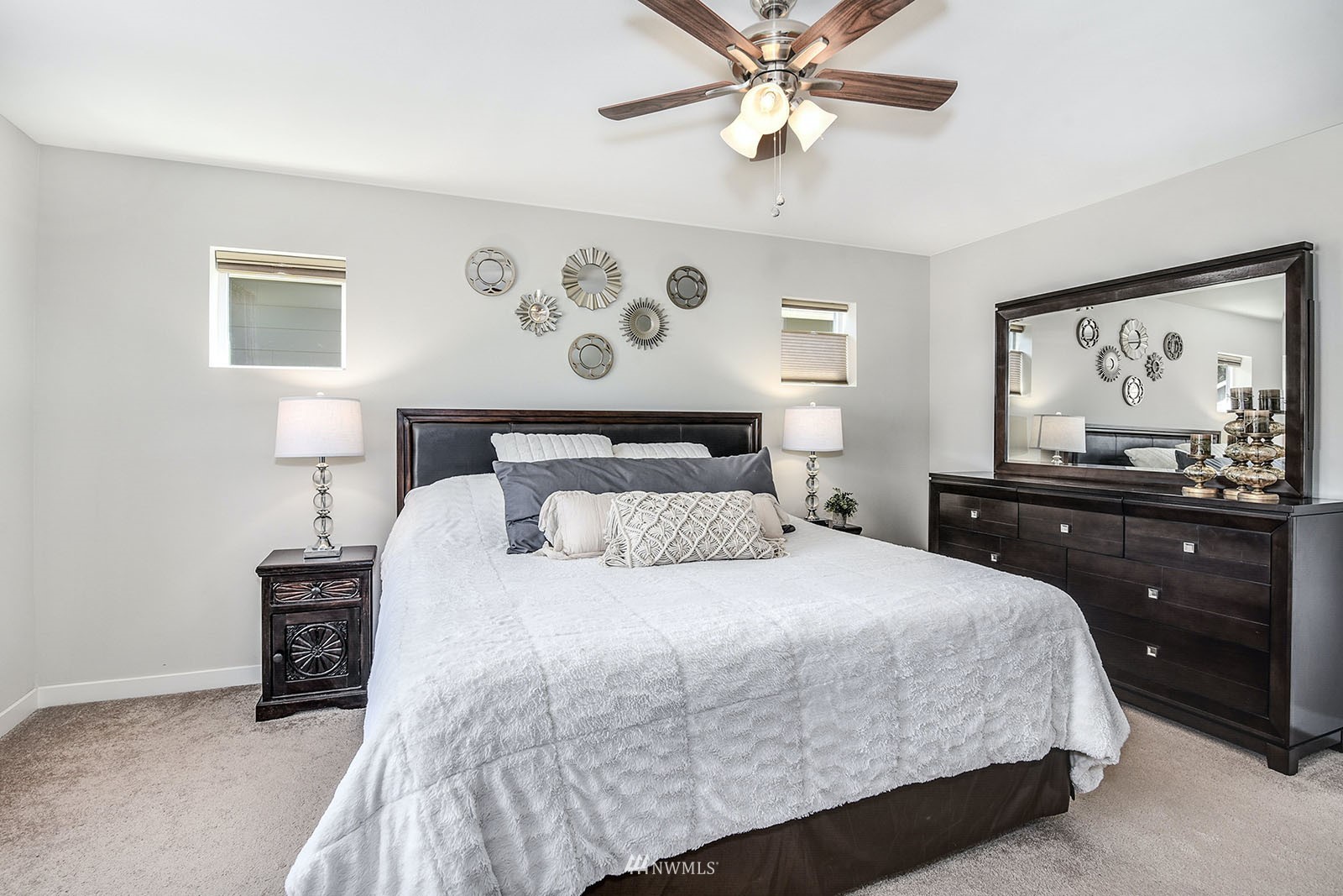 24220 Southeast 258th Way Maple Valley, WA 98038 - Photo 16 of 28 a bedroom with a bed and painting on the wall