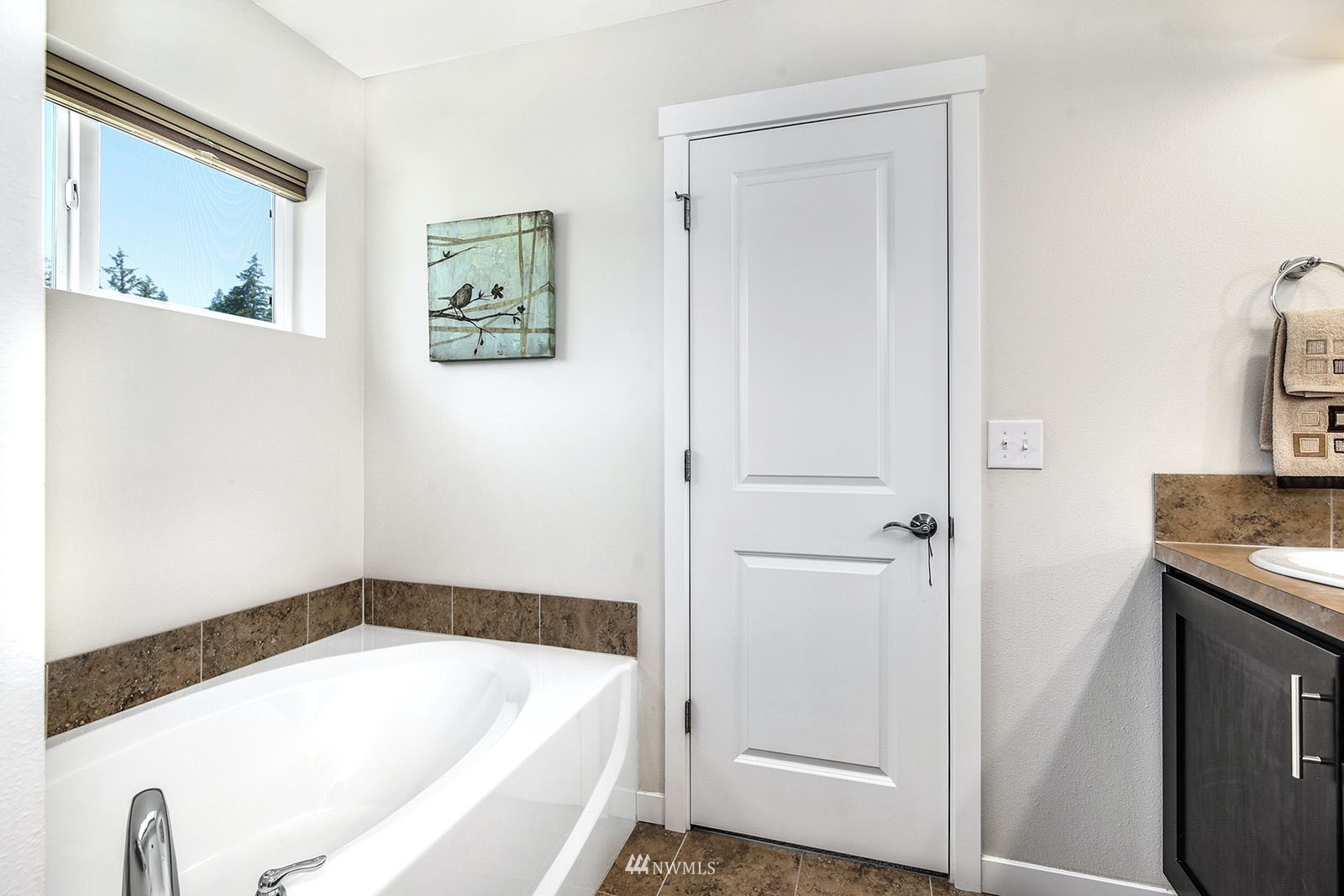 24220 Southeast 258th Way Maple Valley, WA 98038 - Photo 18 of 28 a bathroom with a tub and shower