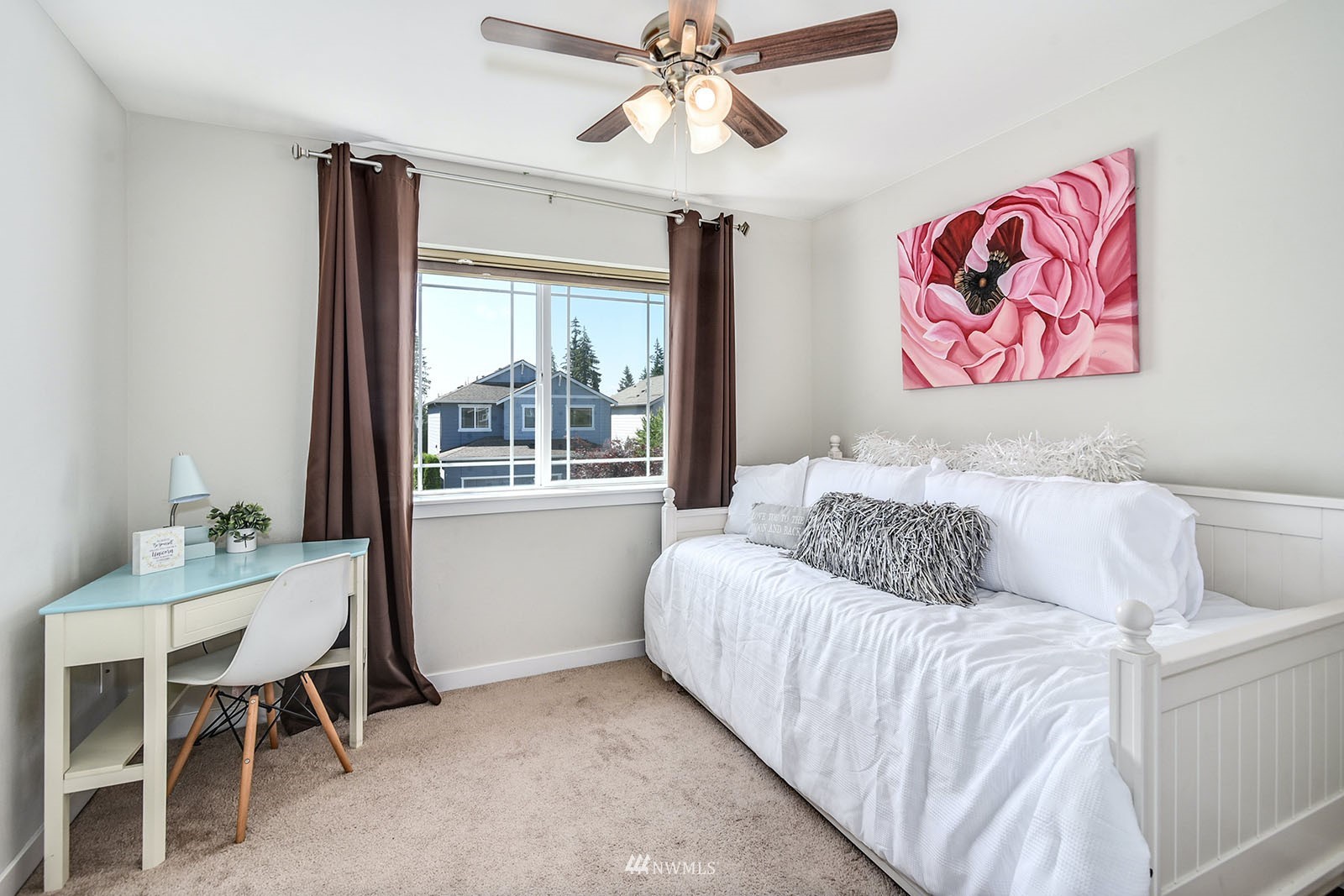 24220 Southeast 258th Way Maple Valley, WA 98038 - Photo 20 of 28 a bedroom with a bed and a table