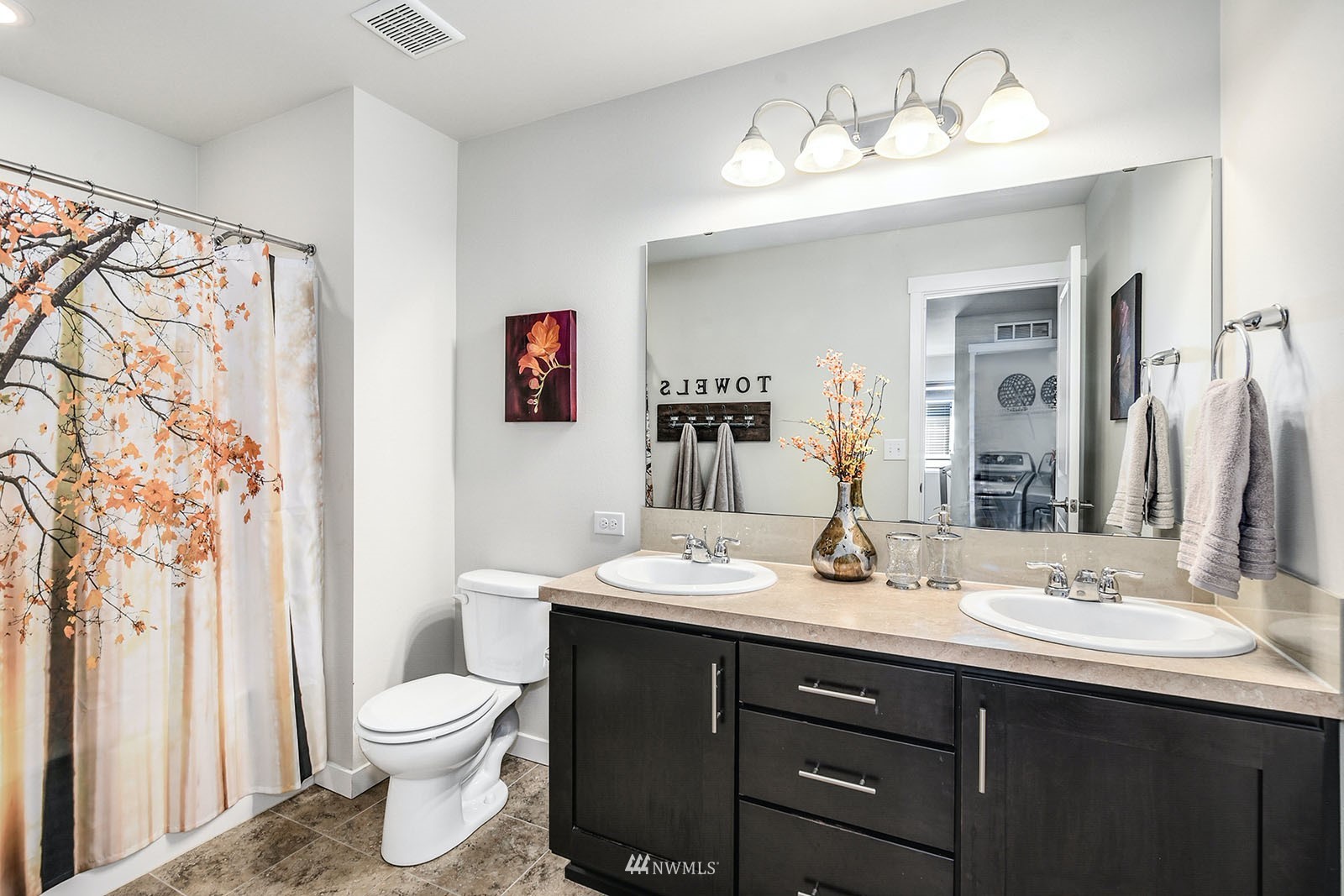 24220 Southeast 258th Way Maple Valley, WA 98038 - Photo 21 of 28 a bathroom with a sink vanity and a mirror