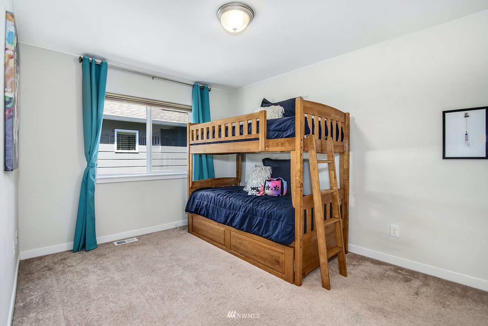 24220 Southeast 258th Way Maple Valley, WA 98038 - Photo 22 of 28 a bedroom with a bed and a window